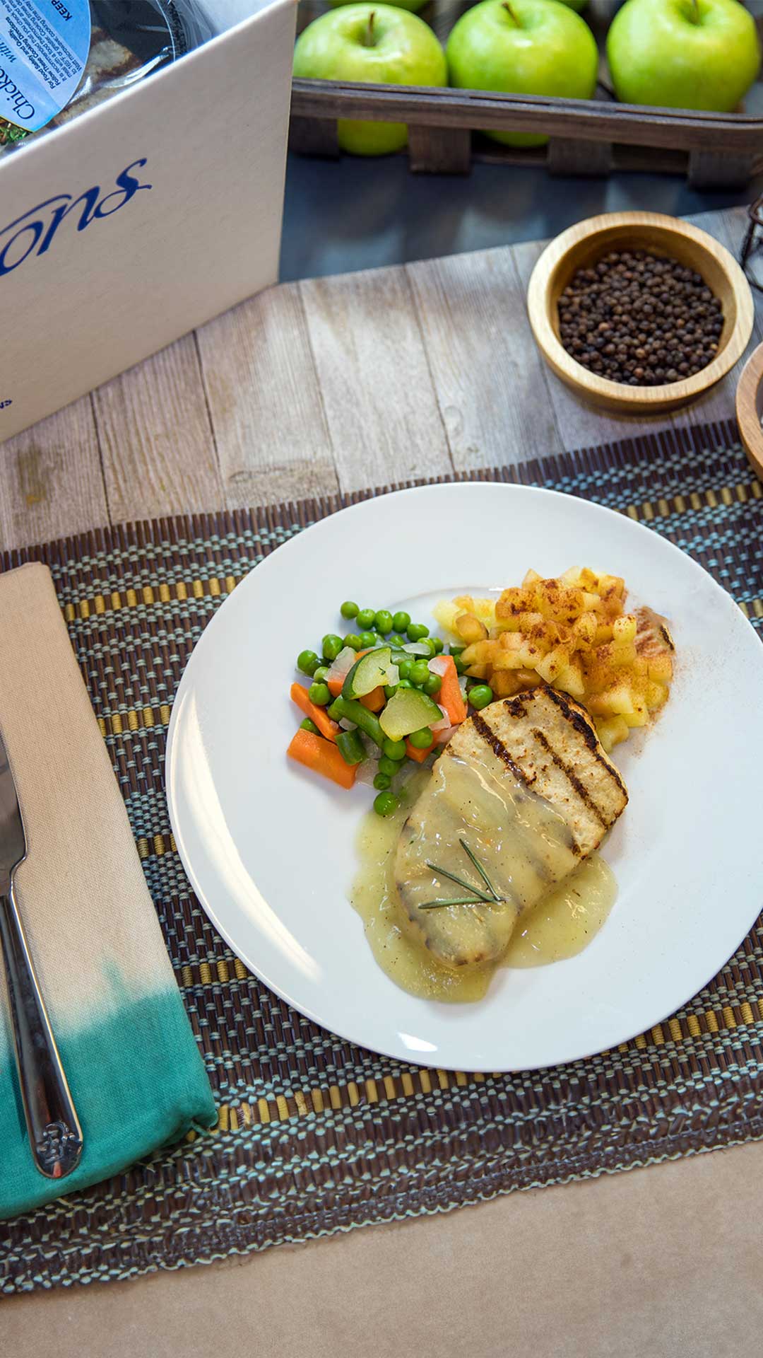 Overhead shot of Traditions Meal of grilled pork and mixed vegetables