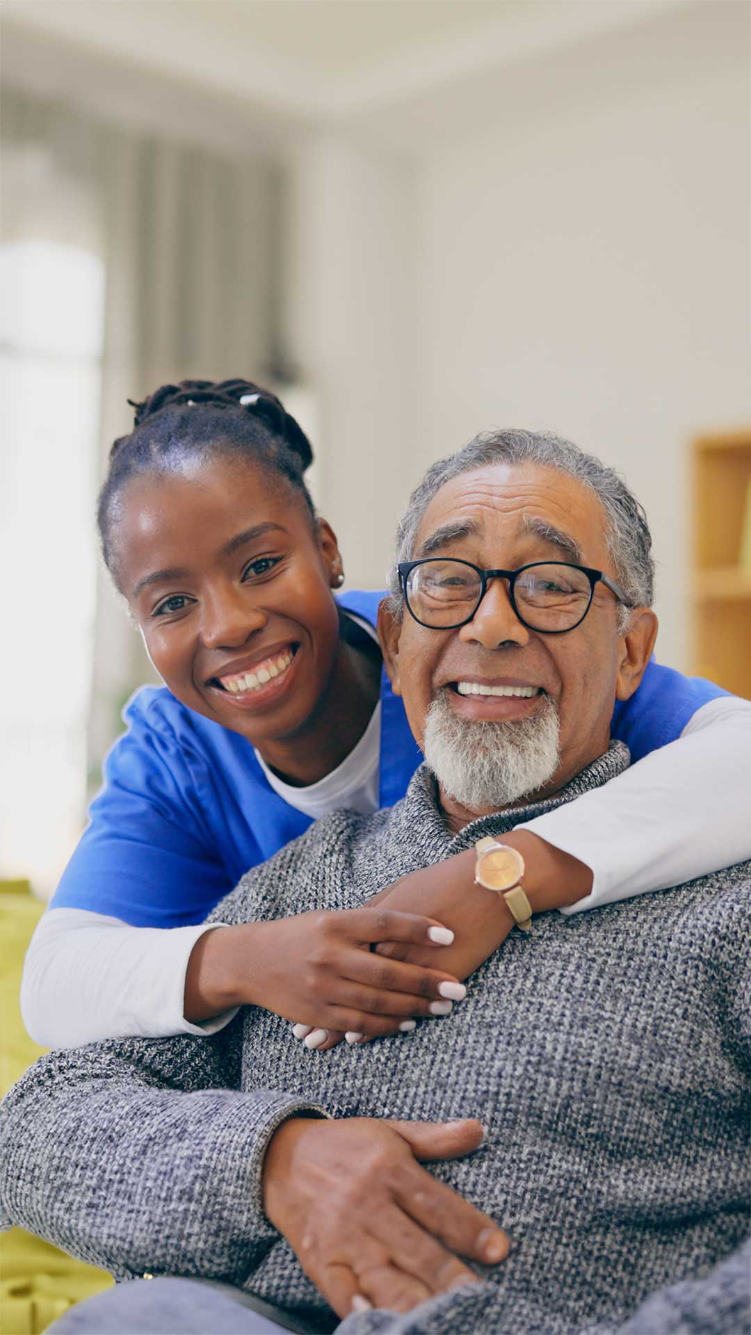 Grandchild and Grandfather happily smiling