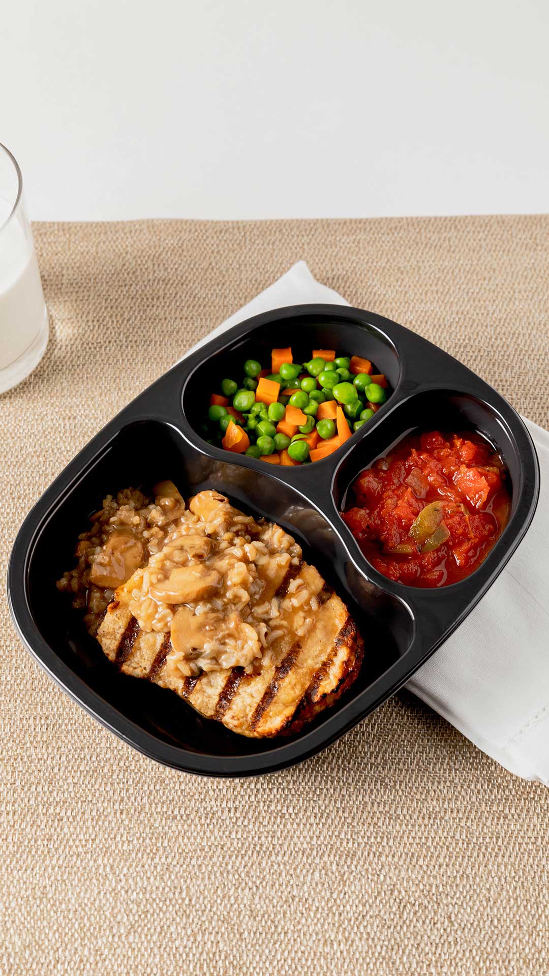 Chicken with mushroom rice, stewed tomatoes and mixed vegetables