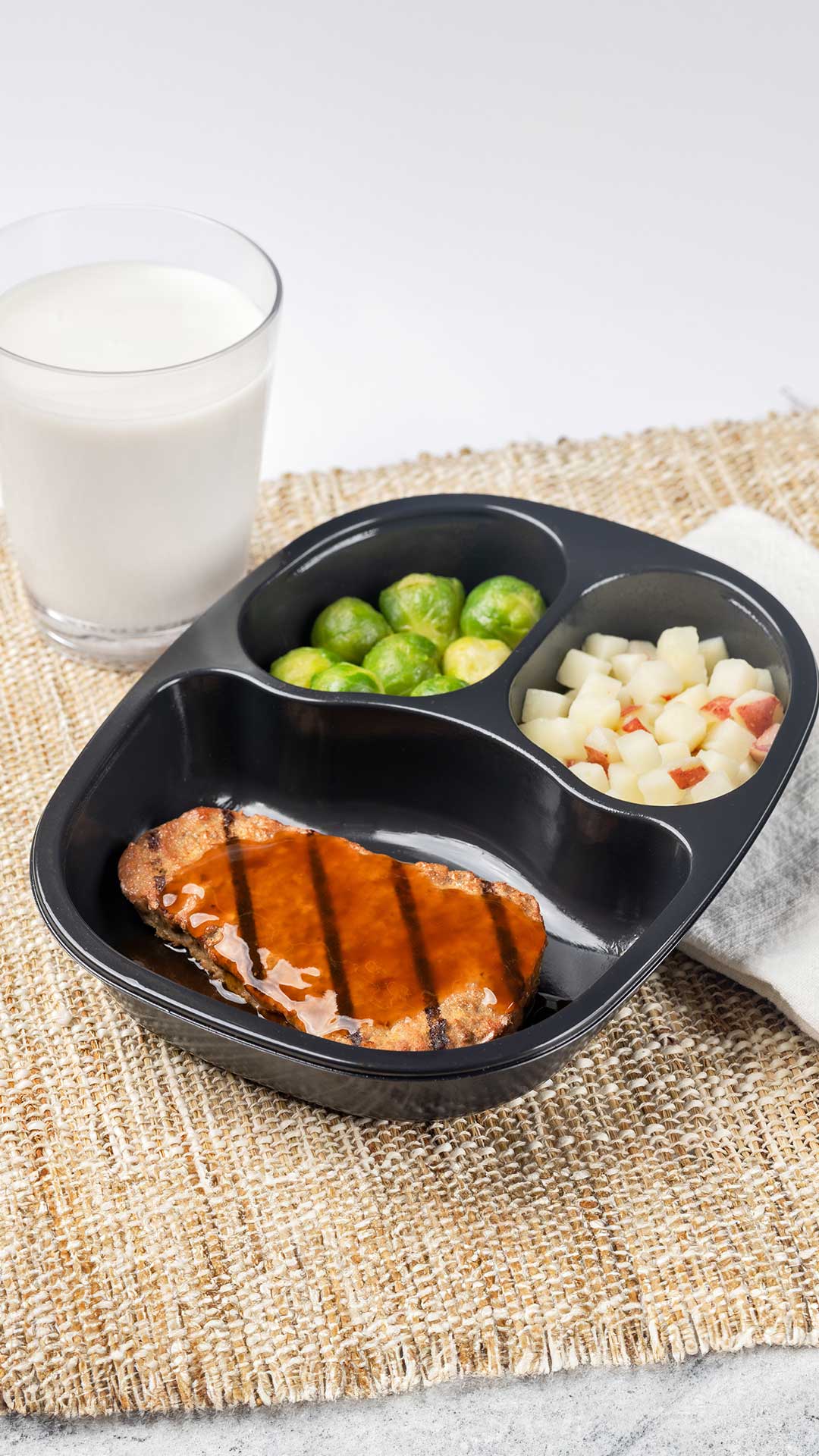 NY Strip Shaped Beef Patty with Horseradish Sauce served with Red Skin Potatoes and Brussels Sprouts